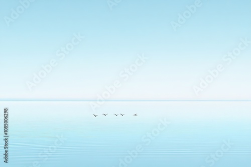 Serene Sky and Water Landscape with Gentle Waves and Flock of Birds in Tranquil Blue Hues Capturing Peaceful Nature and Calmness in Minimalistic Composition