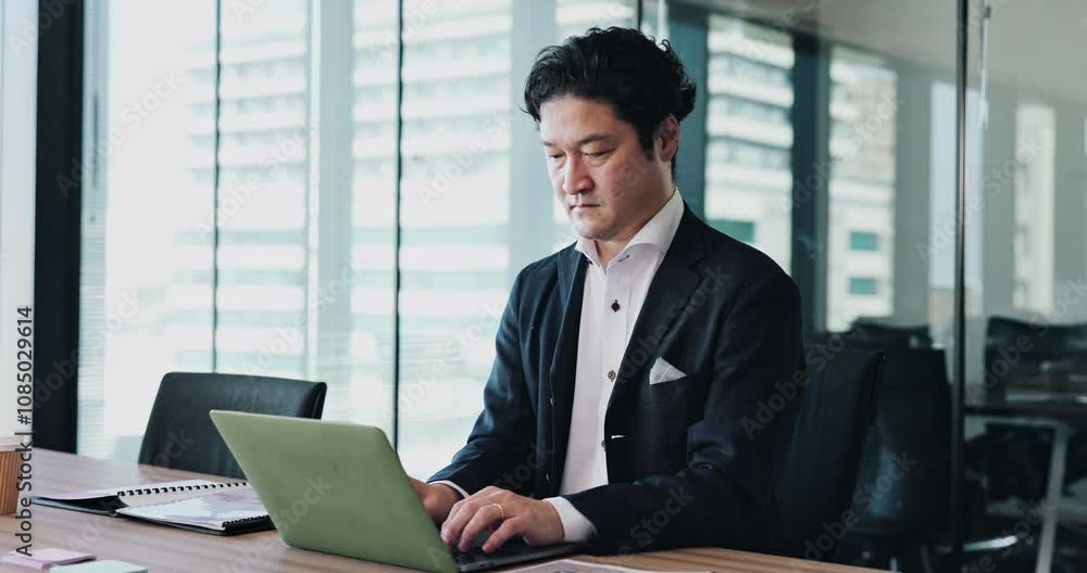 Laptop, planning and thinking with accountant in office for administration, report or research. Japanese businessman, notebook and problem solving with employee for financial goals management online