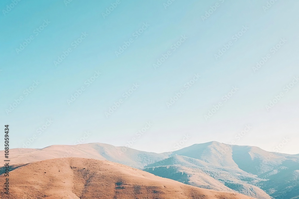 Naklejka premium Serene Mountain Landscape Under Clear Blue Sky