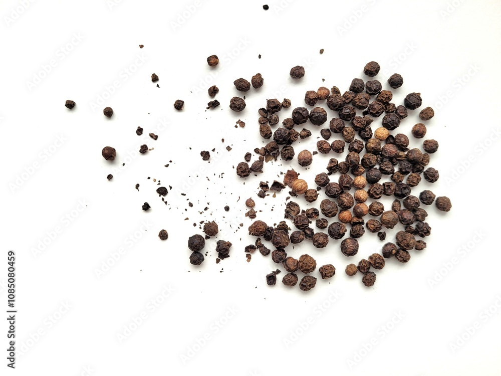 Aromatic portion of raw pepper seeds, on a white background. Aromatic portion of raw pepper seeds, on a white background.