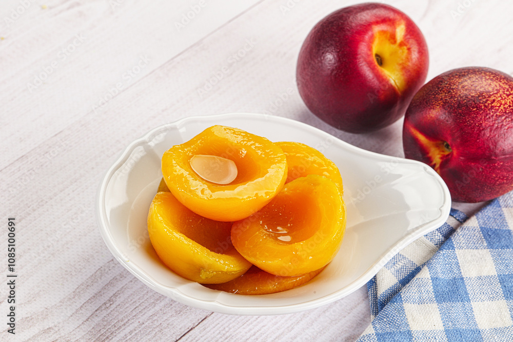 Canned peaches with sweet syrope Canned peaches with sweet syrope