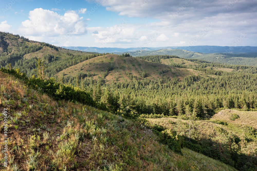 The Southern Urals, Bashkir State Nature Reserve. View of the Southern Kraka ridge in summer. Aerial view. The Southern Urals, Bashkir State Nature Reserve. View of the Southern Kraka ridge in summer. Aerial view.