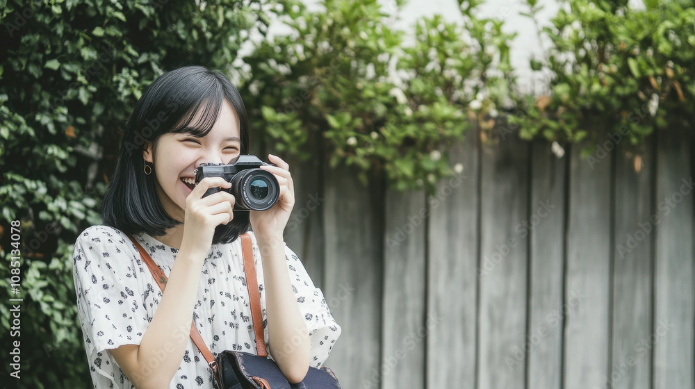 Young Woman with Camera in Lush Greenery Young Woman with Camera in Lush Greenery