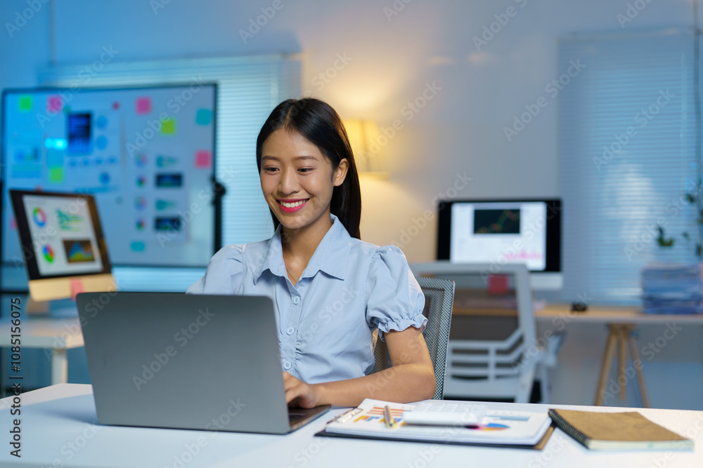 Attractive asian businesswoman sitting working with laptop computer on desk in business growth finance concept Happy marketing plan and customer segments in the office. Attractive asian businesswoman sitting working with laptop computer on desk in business growth finance concept Happy marketing plan and customer segments in the office.