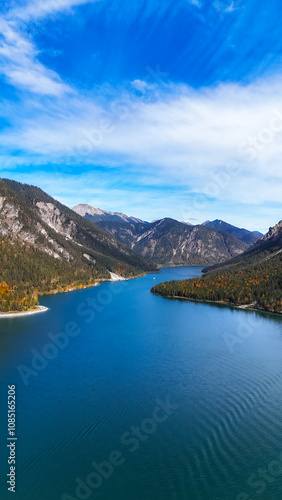 Wallpaper Mural Discover Europe's breathtaking mountain lake. Journey through a breathtaking landscape with a serene lake framed by majestic mountains under a clear sky. Torontodigital.ca