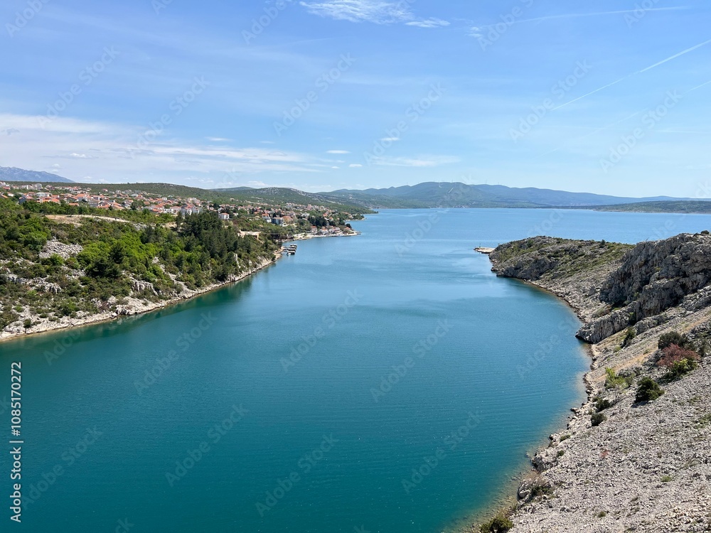 Fototapeta premium Novsko Zdrilo, a strait of the Adriatic Sea in Croatia between the Novigrad Sea and Velebit Channel - Novsko ždrilo, morski prolaz između Novigradskog mora i Velebitskog kanala (Maslenica, Hrvatska)
