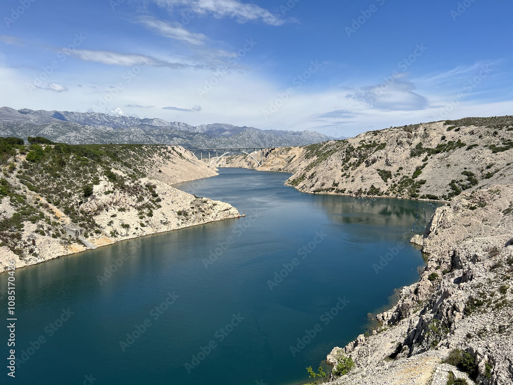 Fototapeta premium Novsko Zdrilo, a strait of the Adriatic Sea in Croatia between the Novigrad Sea and Velebit Channel - Novsko ždrilo, morski prolaz između Novigradskog mora i Velebitskog kanala (Maslenica, Hrvatska)