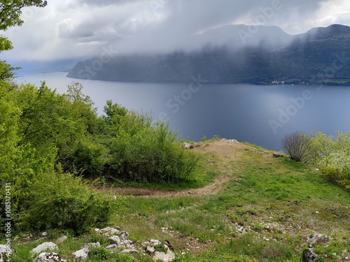 panoramic view of Bourget lake in Chambotte outlook, in haute Savoie, french alps landscape in spring with dramatic sky and rain clouds