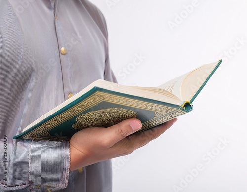 a Muslim holding the Koran, reflects religious values, tranquility, and spiritual connection photo