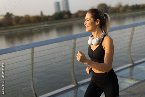 Joyful jogger enjoying a mo...