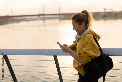 A woman in a yellow hoodie ...