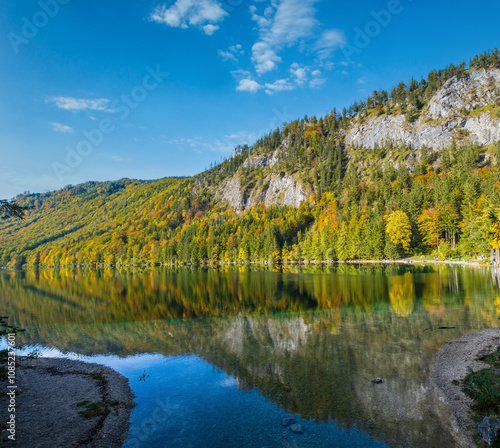 Peaceful autumn Alps mountain lake with clear transparent water and reflections. Langbathseen lake, Upper Austria.