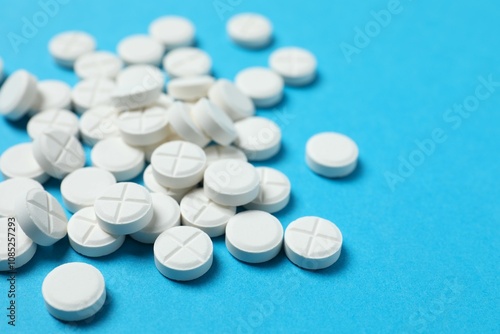 White pills on color background