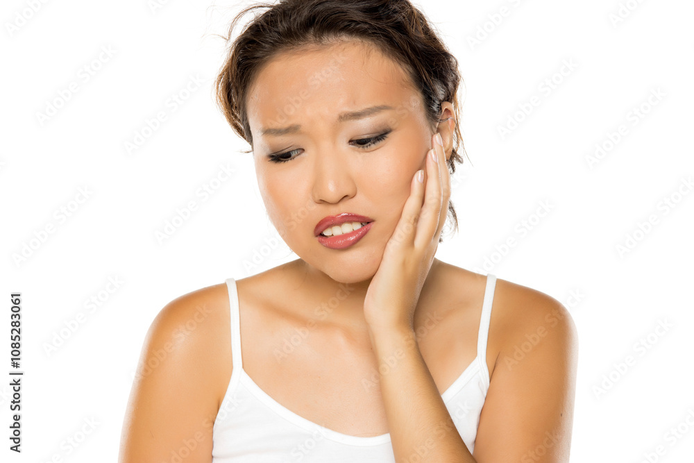 Asian woman suffering from toothache grimacing in pain. Asian woman suffering from toothache grimacing in pain.