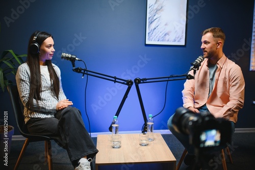 Show host interviewing woman during live stream, talking about fashion and style trends, disagreeing with her opinions. Man arguing with social media celebrity, recording podcast photo