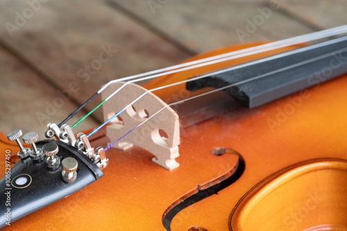 Music instrumnet viloin macro in a wooden table