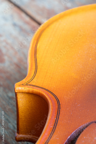 Music instrumnet viloin macro in a wooden table photo