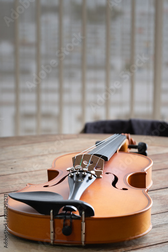 Music instrumnet viloin macro in a wooden table photo