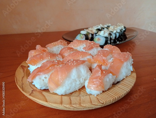 Close-up of Japanese food based on rice and fresh salmon. Sushi and sashimi photo