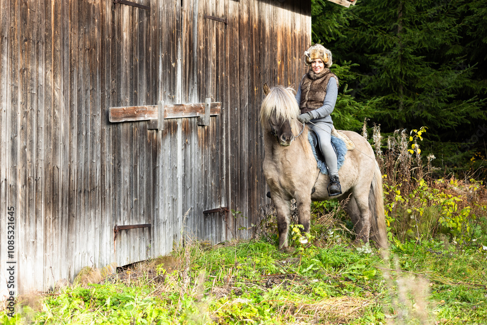 Obraz premium Icelandic horse riding. Rider has werewolf theme outfit
