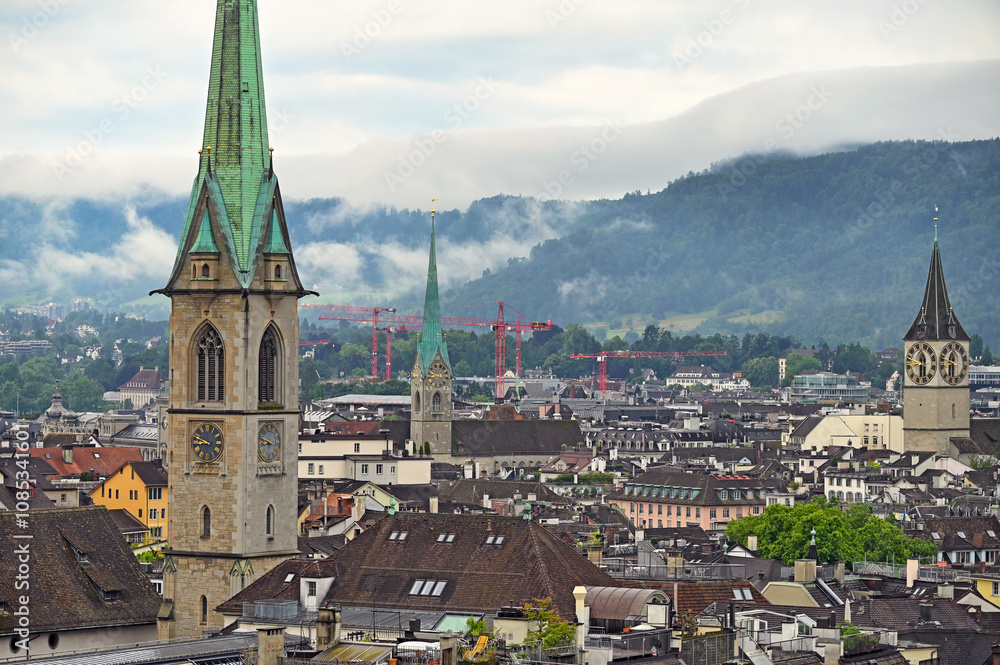 Obraz premium Church clock towers in old town Zurich,cloudy morning,Switzerland
