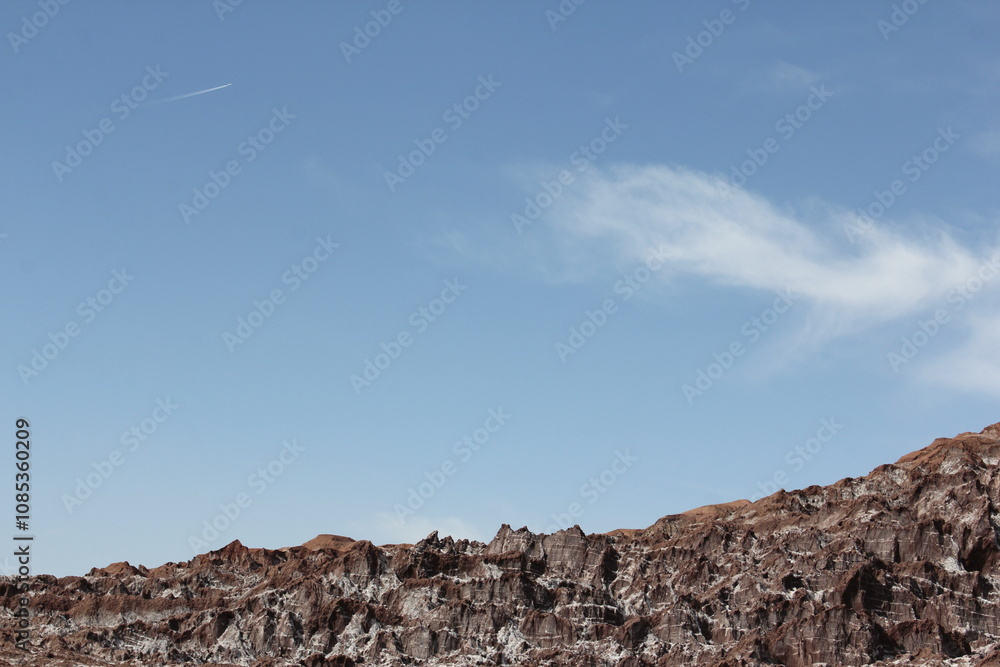 Rocky desert landscape under a clear blue sky, emphasizing the untouched and vast natural beauty. Rocky desert landscape under a clear blue sky, emphasizing the untouched and vast natural beauty.