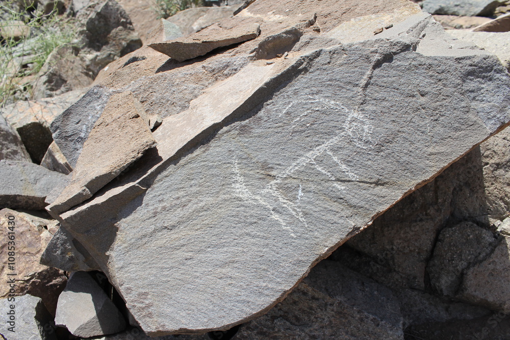 Fototapeta premium Large rocks in an arid landscape, creating a natural, rugged desert view.