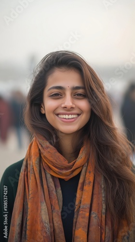 A cheerful Indian woman enjoys a moment of happiness and connection in a bustling environment