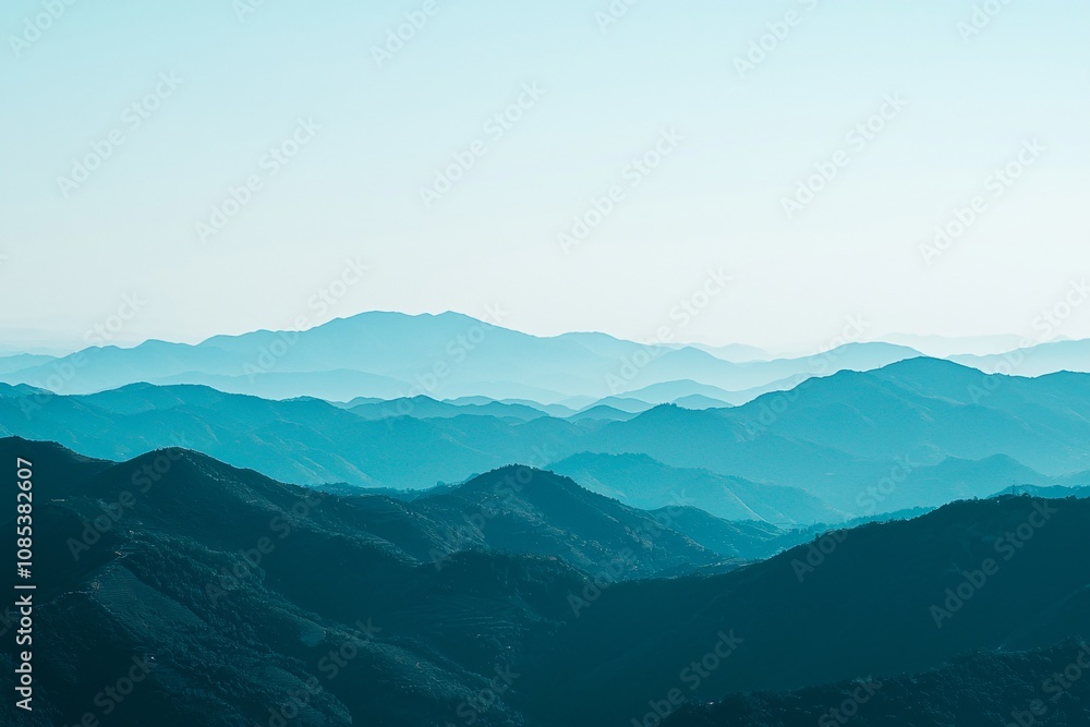 Tranquil Mountain Landscape Under a Blue-Hued Sky Tranquil Mountain Landscape Under a Blue-Hued Sky