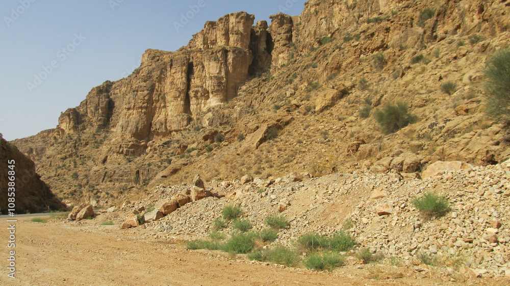 Stony mountains with dry terrain, capturing the harsh beauty of nature. Stony mountains with dry terrain, capturing the harsh beauty of nature.