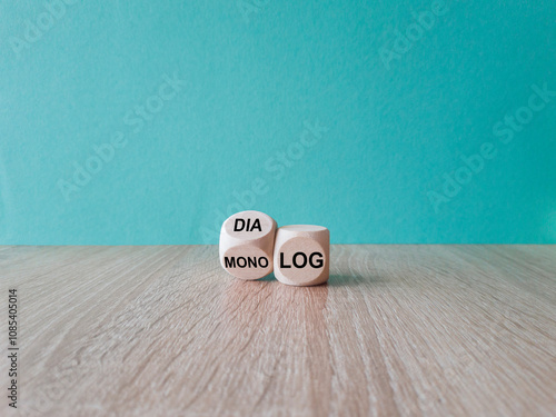 Quadro em tela Turned a wooden cube and changes the German word Monolog (monologue) to Dialog (dialogue)