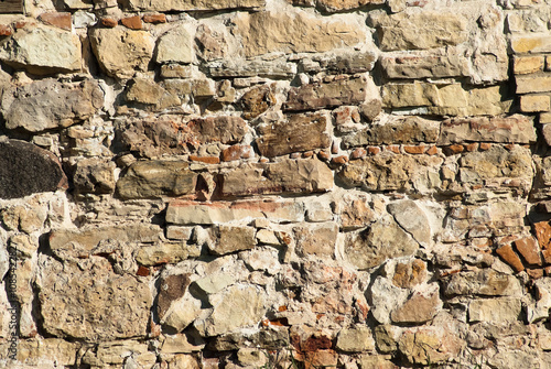 The photo shows a close-up of a stone wall