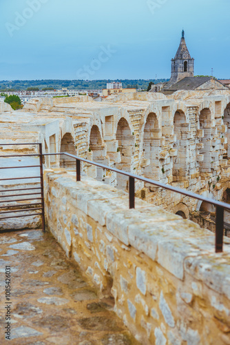 The amphitheater of Arles (arena) was created following Tiberius Caesar Augustus's order to urbanise the city.  This elliptical-shaped Roman amphitheatre has 60 semi-circular arches. photo