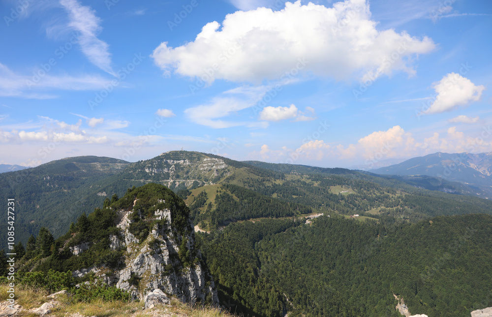 Naklejka premium Mountains of the Prealps Veneto mountain range in northern Italy called Cima Campo Molon with telecommunication repeaters and Cima Toraro
