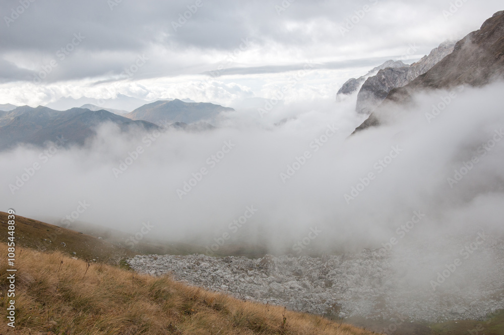 Caucasus mountains including Mount Fisht covered with a thick fog in autumn, Russian Federation Caucasus mountains including Mount Fisht covered with a thick fog in autumn, Russian Federation
