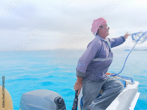 an old sailor with a white mustache who is a retired soldier in the navy wearing a Bedouin scarf on his head
