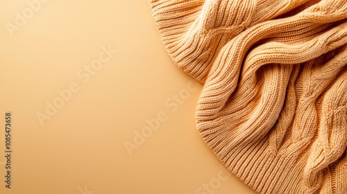 Cozy Beige Knit Sweater on Warm Background photo