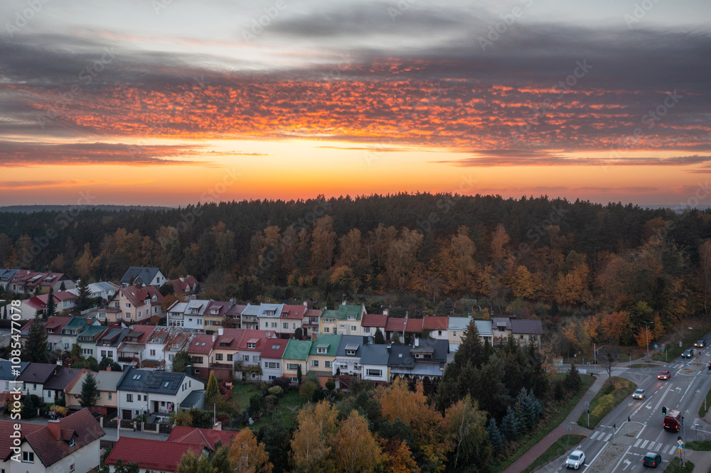 Beautiful sunset over the autumnal forest in Rotmanka, Poland Beautiful sunset over the autumnal forest in Rotmanka, Poland