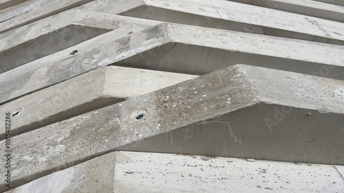 stacked precast concrete elements at a construction site