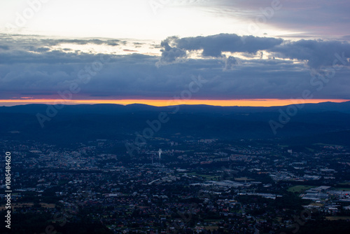 dawn against the backdrop of mountains and a small town