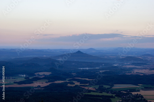 dawn against the backdrop of mountains and a small town