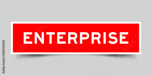 Red color square label sticker with word enterprise that inserted in gray background