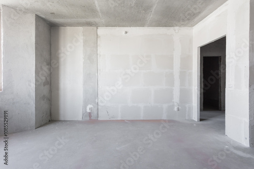 interior of the apartment without decoration in gray colors. rough finish