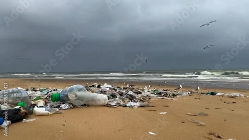 A Beach Overwhelmed by Plastic Waste Highlighting Environmental Pollution photo