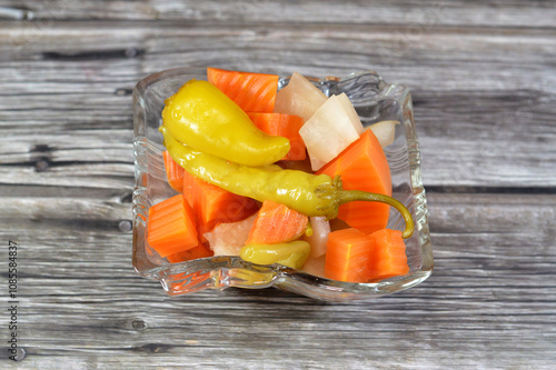 Egyptian pickles marinated vegetables (Torshi) or mixed pickled vegetables of sliced, carrots, beets, turnips, green peppers and salt, Egyptian appetizer Arabian cuisine, selective focus photo