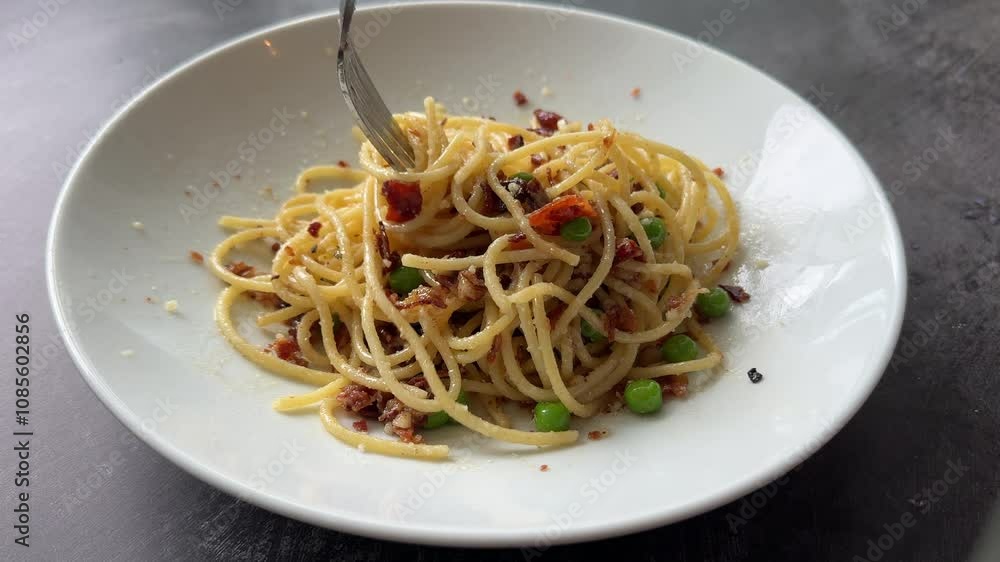 Eating Delicious Pasta Spaghetti Carbonara with Bacon and Peas Eating Delicious Pasta Spaghetti Carbonara with Bacon and Peas