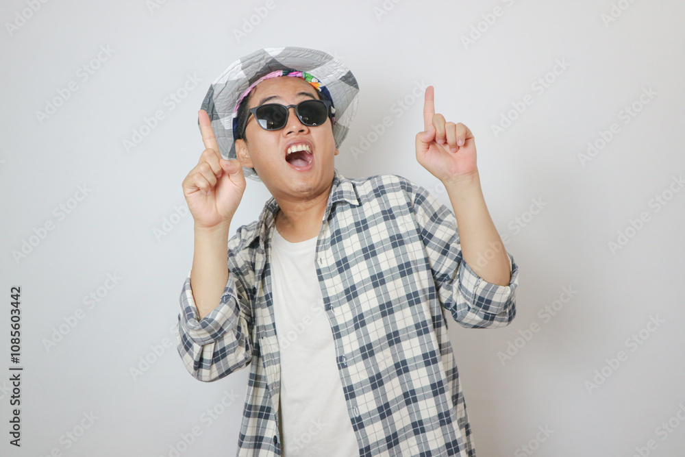 Asian man traveler hold luggage gentle smile gesture point finger white background. Asian man traveler hold luggage gentle smile gesture point finger white background.