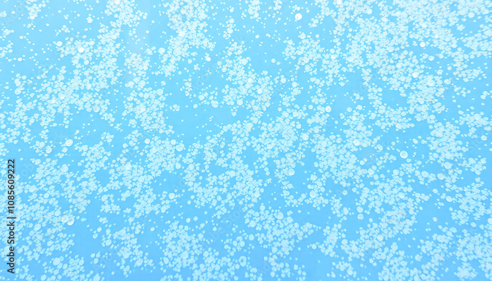 Natural background: macro close-up of ice surface with cracks, ice pieces and bubbles top view. Textured surface of ice. Natural background: macro close-up of ice surface with cracks, ice pieces and bubbles top view. Textured surface of ice.