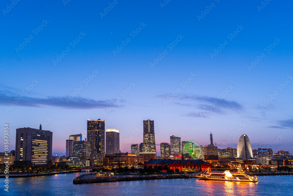 sweet sunset winter and light illumination from Cityscape of Yokohama city, Skyline and office building and downtown in Minatomirai Area, Yokohama city port, Kanagawa, Japan