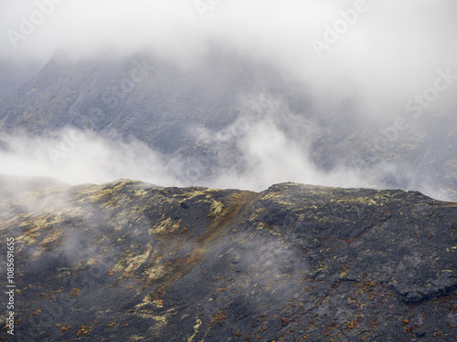 A typical autumn foggy landscape in the Khibiny Mountains in early autumn on the Kola Peninsula in the Arctic Circle